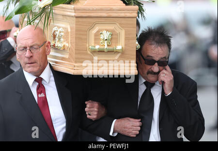 Paul Elliott (right) carries the coffin of his brother Barry Chuckle, 73, (real name Barry Elliott) at the New York Stadium, Rotherham, for his funeral following his death on Sunday August 5. Stock Photo