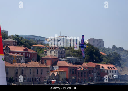 Porto, Portugal - September 1, 2017: Red Bull air race. Training day. Airplane number 10, Kirby Chambliss from USA, in a tight and beautiful maneuver  Stock Photo