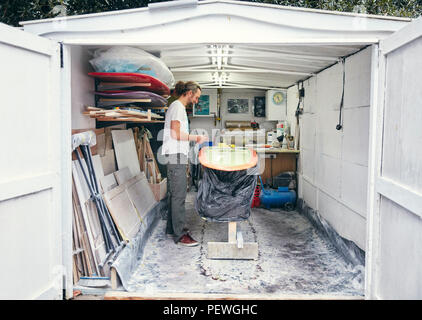 Man making a surfboard in his workshop Stock Photo