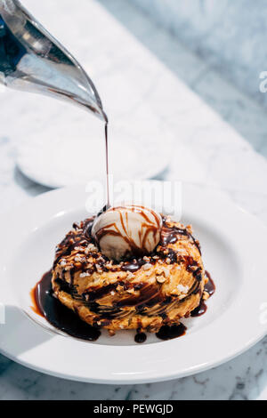 Hazelnut chocolate pralines pâte à choux pastry with hazelnut ice cream Stock Photo