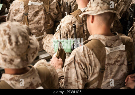 Candidates assigned to Delta Company, Officer Candidates Class-221, complete the day compass course at Brown Field, Marine Corps Base Quantico, Va., Feb. 4, 2016. In order to complete the course, the candidates first calibrated their issued lensatic compasses, then learned how to conduct a pace count on both flat and hilly terrain. (U.S. Marine Corps Photo by Cpl. Patrick H. Owens/Released) Stock Photo