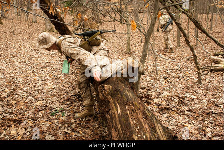 Candidates assigned to Delta Company, Officer Candidates Class-221, complete the day compass course at Brown Field, Marine Corps Base Quantico, Va., Feb. 4, 2016. In order to complete the course, the candidates first calibrated their issued lensatic compasses, then learned how to conduct a pace count on both flat and hilly terrain. (U.S. Marine Corps Photo by Cpl. Patrick H. Owens/Released) Stock Photo