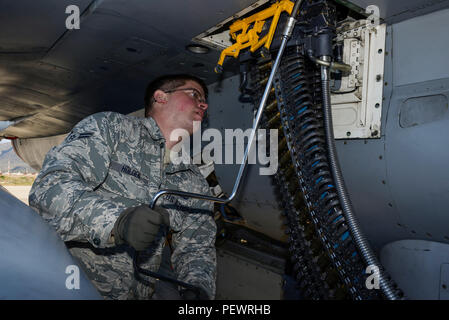 U.S. Air Force Airman 1st Class Austin Holden, a weapons load crew member assigned to the 480th Expeditionary Fighter Squadron, Spangdahlem Air Base, Germany, uses a universal ammunition loading system to load 20 mm practice rounds into an F-16 Fighting Falcon fighter aircraft during a flying training deployment on the flightline at Souda Bay, Greece, Jan. 29, 2016.The inert munitions used during the FTD simulate real conditions the 480th EFS pilots might use when engaging enemy forces. (U.S. Air Force photo by Staff Sgt. Christopher Ruano/Released) Stock Photo