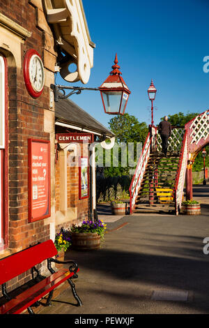 UK, Cumbria, Eden Valley, Appleby Station, Settle to Carlisle Line, historic clock, lamp and footbridge Stock Photo