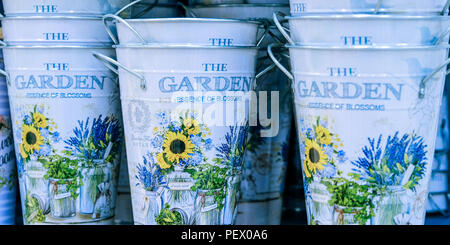 Buckets for flowers. An empty bucket with vintage floral decorations on white background. Stock Photo