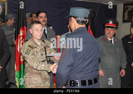 U.S. Army Lt. Col. Edgar and Maj. Arntson salute during the playing of ...