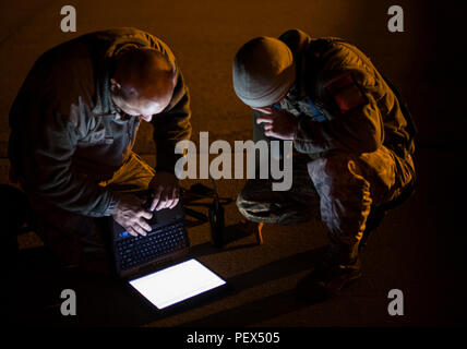 Tech. Sgt. Brian Carroll, a hydraulics specialist from the 437th Maintenance Squadron and Staff Sgt. Mark Rippy, air reserve technician hydraulics specialist, 315th MXS, working with the 437th MXS read over the appropriate technical orders to perform panel removal prior to beginning work as part of troubleshooting steps to isolate a flight control system fault on a transient C-17 Globemaster III cargo aircraft on the flightline at Joint Base Charleston, S.C. Compliance with technical data, while mandatory, also serves to ensure effective and efficient maintenance is performed safely. (U.S. Air Stock Photo