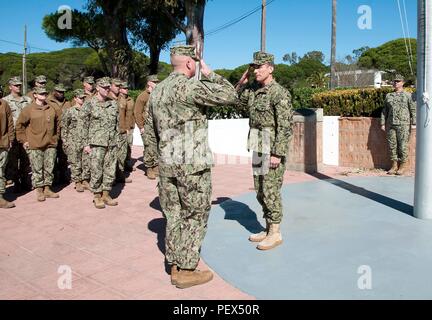 160216-N-MW990-084 NAVAL STATION ROTA, Spain (Feb. 16, 2016) Cmdr. Kemit Spears, left, commanding officer, Naval Mobile Construction Battalion (NMCB) 1, exchanges salutes with Capt. Joseph Polanin, commander, Naval Expeditionary Task Force Europe and Africa, during a turnover ceremony between NMCB 1 and NMCB 133 at Naval Station Rota, Spain, Feb. 16, 2016. The turnover marked the beginning of the NMCB 133 deployment to Rota’s Seabee camp, Camp Mitchell. U.S. 6th Fleet, headquartered in Naples, Italy, conducts the full spectrum of joint and naval operations, often in concert with allied, joint, Stock Photo