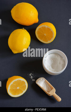 Lemon and baking soda on black background Stock Photo