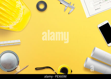 Work desk of the architect or builder with all the necessary tools, projects and instruments for measurement. Free space in the middle for text. Top v Stock Photo