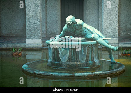 MUNICH, GERMANY - JULY 24, 2018 -   Bavarian National Museum of decorative arts in Munich, Narcissus fountain in the courtyard, built in 1896 by Huber