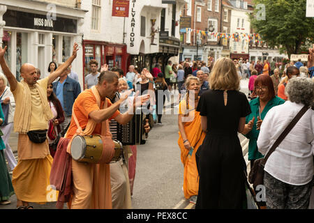 Hare Krishna's playing musical instruments and chanting in York City centre, North Yorkshire, England, UK. Stock Photo