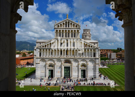 View of Cathedral, Leaning Tower of Pisa and Miracles Square with tourists from Baptistery window Stock Photo