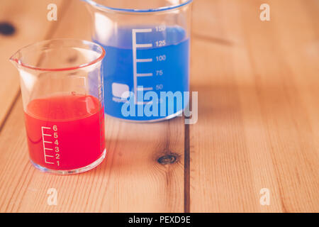 Glass measuring beaker in Laboratory, Science experiment concept Stock Photo