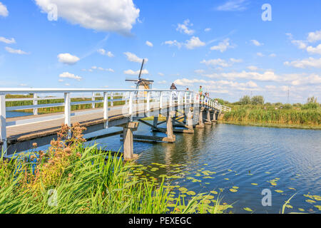 Kinderdijk, Netherlands - August 17, 2018: Bridge To Cross The Canal At Kinderdijk Stock Photo