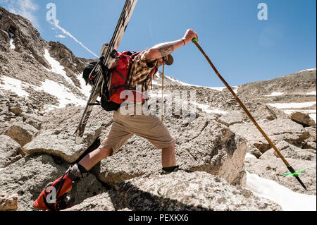 Man hiking with skis, La Plata Mountains, Colorado, USA Stock Photo