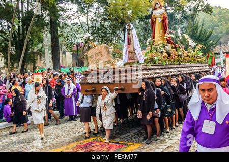 Antigua, Guatemala - April 3, 2015: Good Friday procession in UNESCO World Heritage Site with most famous Holy Week celebrations in Latin America.