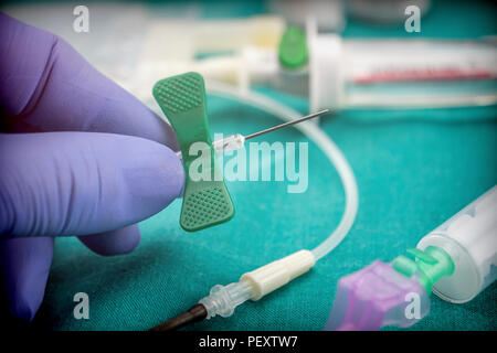 Doctor hold Scalp Vein Needle for Single Use in the hospital Stock Photo