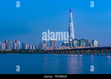 Jamsil railway bridge crossing the Han River and Lotte World Tower in Seoul capital city of South Korea Stock Photo