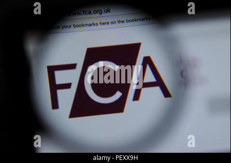 The The Financial Conduct Authority website seen through a magnifying glass Stock Photo
