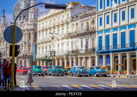 Colourful Street View of American Cars at road junction in Havana Stock Photo