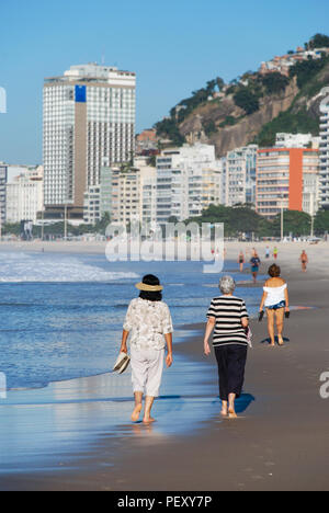 Female Relaxing On The Sunny Copacabana Beach In Rio De 