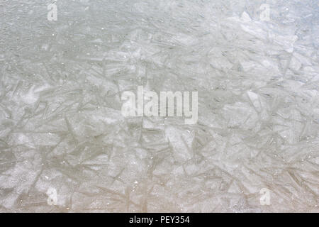 Texture of frozen water in winter ice skating on the lake Stock Photo