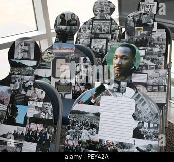 Evoking Emotion through Art, an interactive display on Naval Hospital Bremerton’s Quarterdeck by Hospital Corpsman 2nd Class ViJorge Potal, represents Rosa Parks and her refusal to move to the back of the bus. Each chair is occupied by a silhouette, and within each silhouette is a collage of significant events that helped change the course of history during the Civil Rights Movement. A Viewer can take part and have a seat in the unoccupied chair. The simple act of participating simulates Parks when she refused to move in 1955.  The viewer is then asked to observe their immediate surroundings a Stock Photo