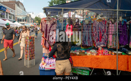 Ukeleles and other merchandise for sale at a street fair on Steinway Street in the Astoria neighborhood of Queens in New York on Sunday, August 12, 2018. (Â© Richard B. Levine) Stock Photo