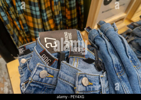 High-waisted mom jeans in Urban Outfitters retail store in Herald Square New York on Thursday, August 9, 2018. Retailers are hoping that a revival of 90's such as fanny