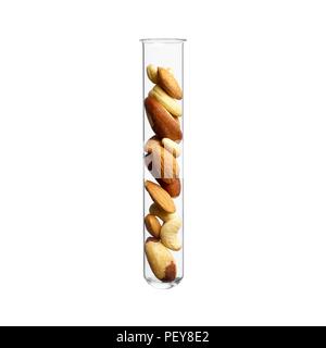 Mixed nuts in test tube, studio shot. Stock Photo