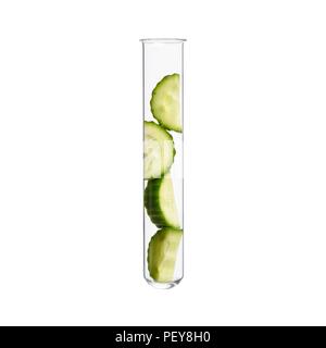 Cucumber in test tube, studio shot. Stock Photo