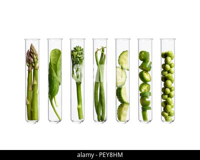 Vegetables in test tubes, studio shot. Stock Photo