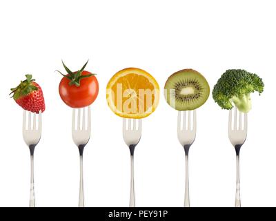 Fresh fruit and vegetables on forks. Stock Photo