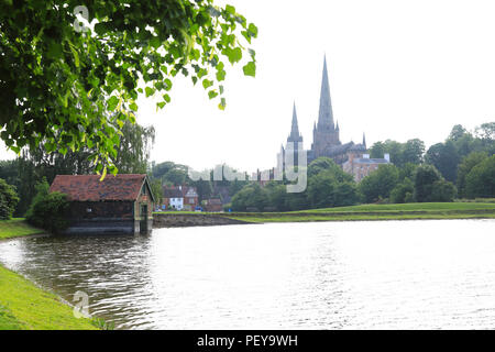 View of historic Lichfield Cathedral, seen across Stowe Pool, in Staffordshire, England, UK Stock Photo