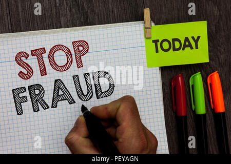 Conceptual hand writing showing Stop Fraud. Business photo text campaign advices people to watch out thier money transactions Man holding marker noteb Stock Photo