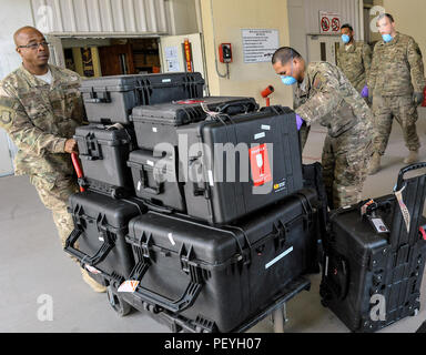 A 455th Expeditionary Medical Group team handles the Extracorporeal Membrane Oxygenation team’s equipment during a patient transfer at the Craig Joint-Theater Hospital at Bagram Air Field, Afghanistan, on Feb. 18, 2016. The ECMO team, dispatched from San Antonio Military Medical Center, uses technology that bypasses the lungs and infuses the blood directly with oxygen, while removing the harmful carbon dioxide from the blood stream. The patient was airlifted to Landstuhl Regional Medical Center, Germany, where he will receive 7 to 14 days of additional ECMO treatment. (U.S. Air Force photo by  Stock Photo