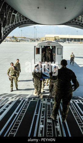 A 455th Expeditionary Medical Group team loads a NATO ally, who required Extracorporeal Membrane Oxygenation team support, onto an aeromedical evacuation transport at Bagram Air Field, Afghanistan, on Feb. 18, 2016. The ECMO team, dispatched from San Antonio Military Medical Center, uses technology that bypasses the lungs and infuses the blood directly with oxygen, while removing the harmful carbon dioxide from the blood stream. The patient was airlifted to Landstuhl Regional Medical Center, Germany, where he will receive 7 to 14 days of additional ECMO treatment. (U.S. Air Force photo by Tech Stock Photo