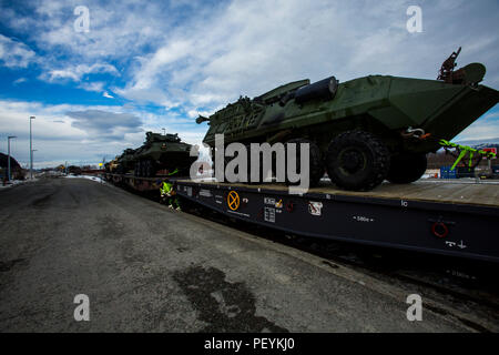 Light Armored Vehicles were transported by train during Exercise Cold Response 16 at Hell, Norway, on February 20, 2016. The Norwegian-hosted exercise involved approximately 16,000 troops from 12 NATO and partner countries. The exercise focused on rapid deployment, armored mobility, combined arms operations, multinational coordination, and readiness in Arctic conditions. Stock Photo