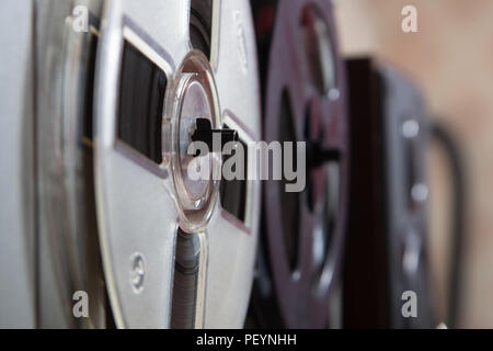 Old reel-to-reel recorder with magnetic tape on it Stock Photo