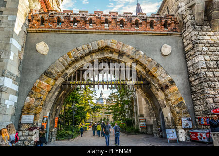 Tourists and local Hungarians enter Vajdahunyad Castle in the City Park of Budapest, Hungary, built in 1896 as part of the Millennial Exhibition. Stock Photo