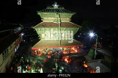 Kathmandu, Nepal. 17th Aug, 2018. Devotees gather at Bagh Bhairav temple to offer prayers during the Bagh Bhairav Festival at Kirtipur in Kathmandu, Nepal, Aug. 17, 2018. Devotees offered prayers and made 108 rounds of the Bagh Bhairav temple to get rid of sins during the Bagh Bhairav Festival. Credit: Sunil Sharma/Xinhua/Alamy Live News Stock Photo