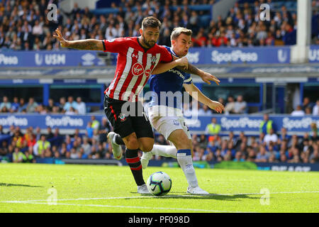 Liverpool, UK. 18th August 2018. Charlie Austin of Southampton (l) battles with Seamus Coleman of Everton. Premier League match, Everton v Southampton at Goodison Park in Liverpool on Saturday 18th August 2018.  this image may only be used for Editorial purposes. Editorial use only, license required for commercial use. No use in betting, games or a single club/league/player publications. pic by Chris Stading/Andrew Orchard sports photography/Alamy Live news Stock Photo