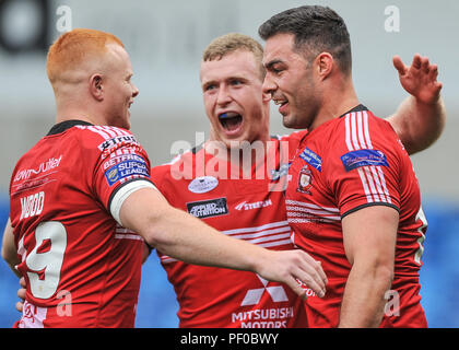 Salford, UK. 18/8/2018. Rugby League Super 8's Salford Red Devils vs Widnes Vikings ; Team mates congratulate try scorer Mark Flanagan at the AJ Bell Stadium, Salford, UK.  Dean Williams Stock Photo