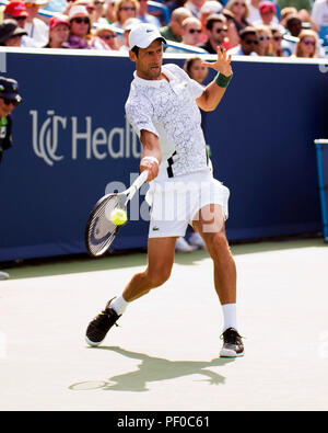 Ohio, USA. 18 August 2018.  Novak Djokovic (SRB) hits the ball back to Marin Cilic (CRO) the Western Southern Open in Mason, Ohio, USA. Brent Clark/Alamy Live News Stock Photo