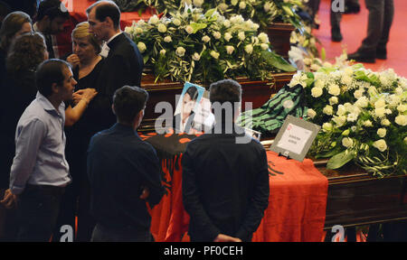 Genoa, Italy. 18 August 2018. A state funeral to honor victims of the bridge collapse is held in the northwest Italian city of Genoa, on Aug. 18, 2018. Thousands of people gathered in Genoa on Saturday to mourn the victims of a dramatic bridge collapse that killed dozens of people earlier this week. (Xinhua) Credit: Xinhua/Alamy Live News Stock Photo