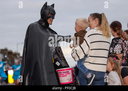 Southend SummerCare Carnival Procession. Southend on Sea, Essex, UK. Thundersley Superhero Alliance Batman in the carnival parade. Charity Stock Photo