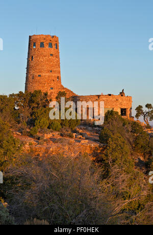 AZ00309-00...ARIAONA - The warm glow of early morning sunlight on the The Desert View Watchtower in Grand Canyon National Park. Stock Photo