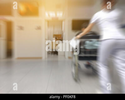 Blurred image of unidentified people with nurse in hospital waiting for doctor in waiting room Stock Photo