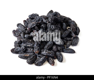 Heap of black raisins isolated on white background. Stock Photo